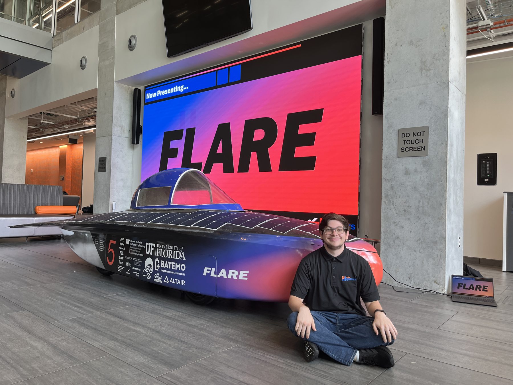 Christian Vincente sitting with Flare at the reveal